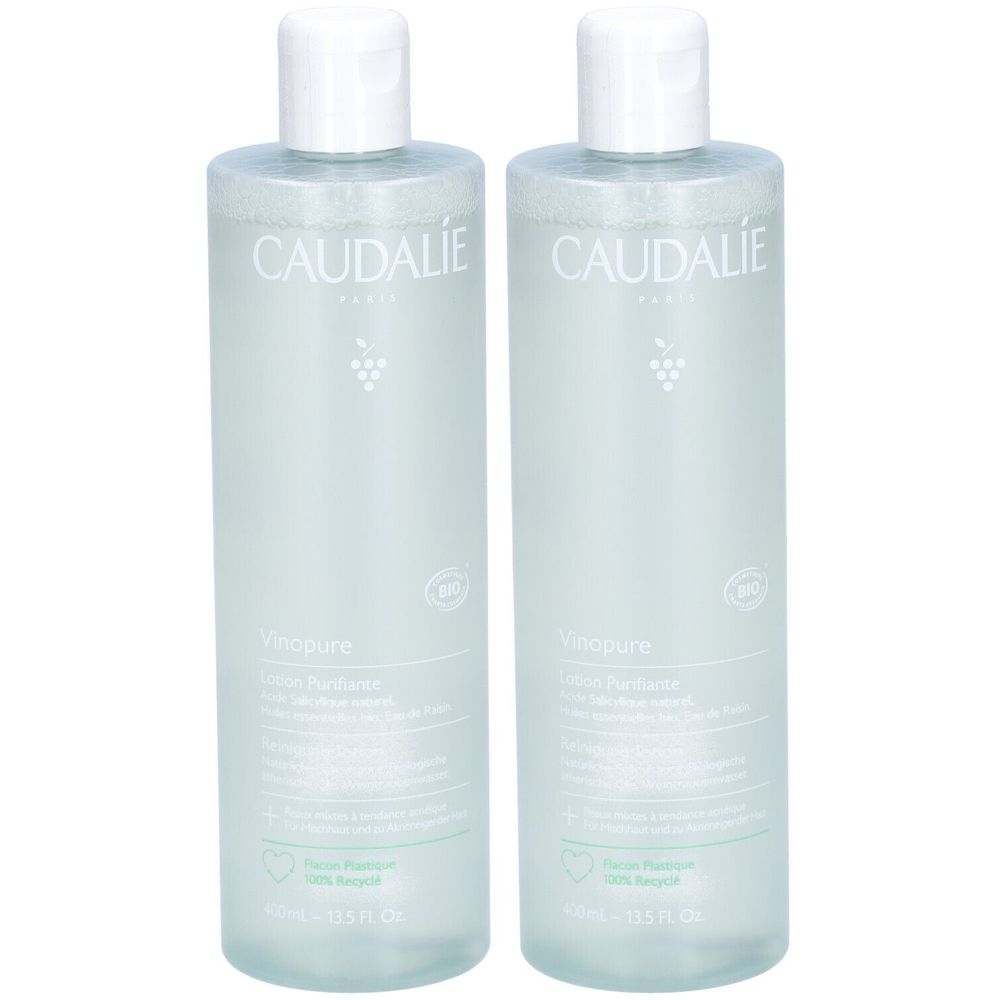 Twee flessen met witte dop. Opschrift Caudalie, Vinopure Lotion Purifiante. Groen etiket, recyclinglogo.