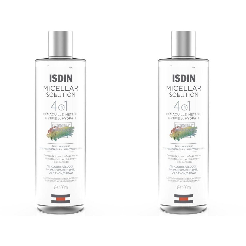 Deux flacons de ISDIN Micellar Solution 4-en-1. Liquide clair dans des bouteilles cylindriques avec des bouchons argentés. Texte sur l'étiquette.