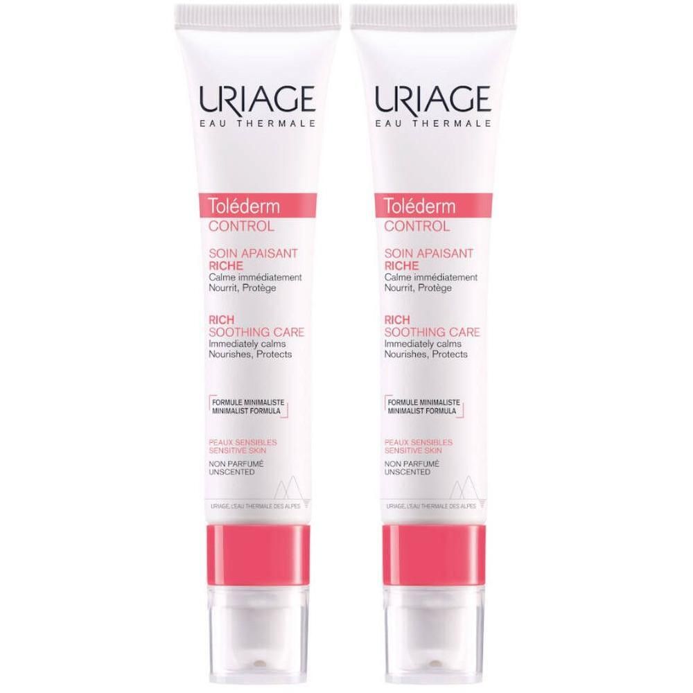 Twee crèmetubes. Wit, met roze en grijze tekst. Merk: URIAGE. Productnaam: Toléderm CONTROL Soin Apaisant Riche.