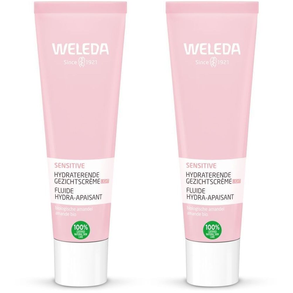 Deux tubes roses avec bouchon blanc. Inscription: WELEDA, SENSITIVE, HYDRATERENDE GEZICHTSCRÈME, FLUIDE HYDRA-APAISANT.