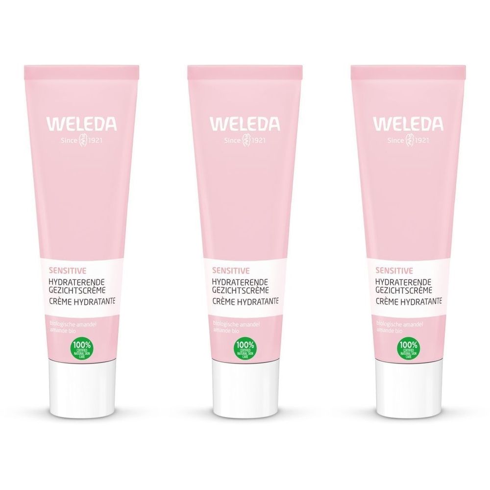Drie roze tubes met witte doppen. Op elke tube staat "WELEDA" en "SENSITIVE HYDRATERENDE GEZICHTSCRÉME CRÈME HYDRATANTE".