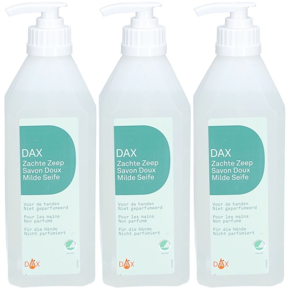 Drie witte flessen met pomp. Labels met DAX-logo en tekst: Zachte Zeep, Savon Doux, Milde Seife. Niet geparfumeerd.