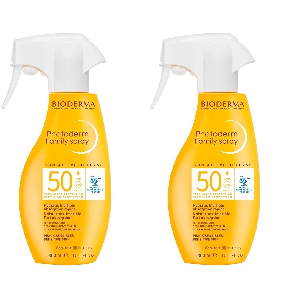 Deux flacons spray jaunes avec pulvérisateur blanc. Inscription: BIODERMA Photoderm Family Spray SPF50+. Protection UV.