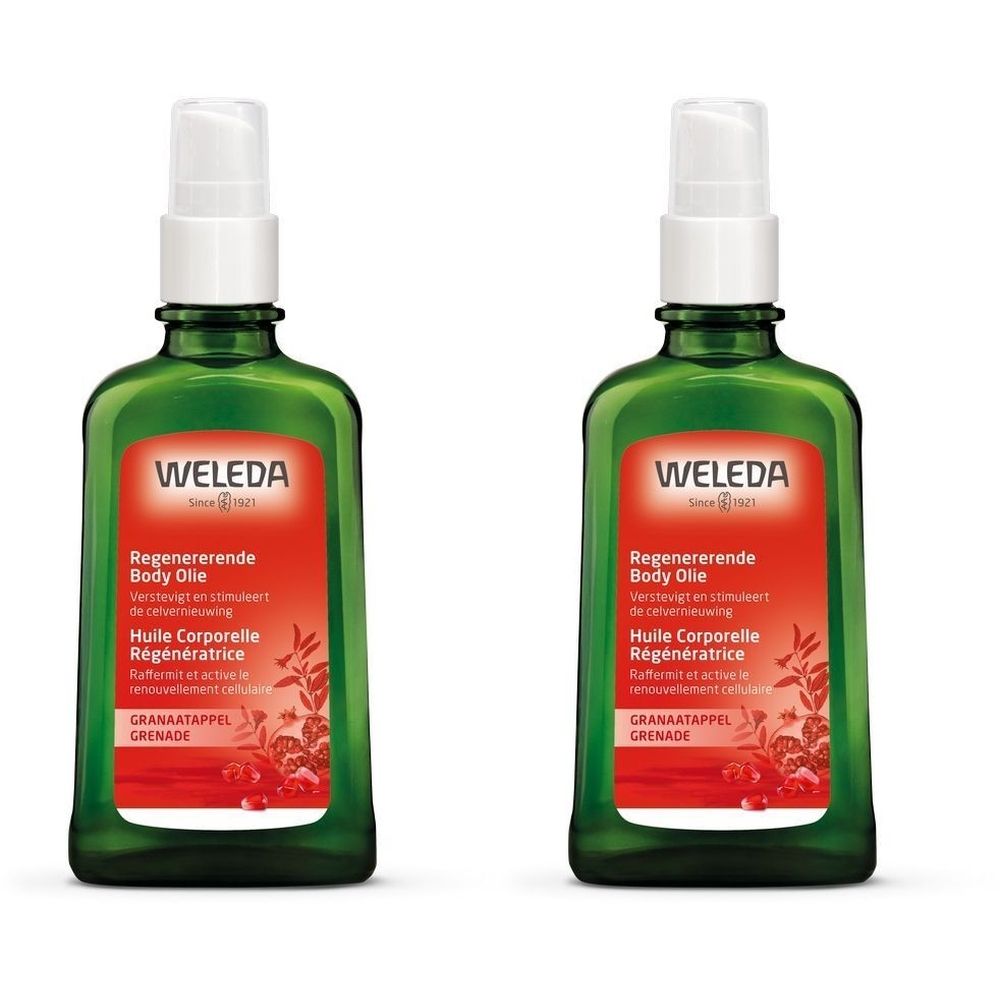 Deux flacons verts avec vaporisateur. Étiquettes rouges avec texte: Weleda, Huile Corporelle Régénératrice, Grenade.