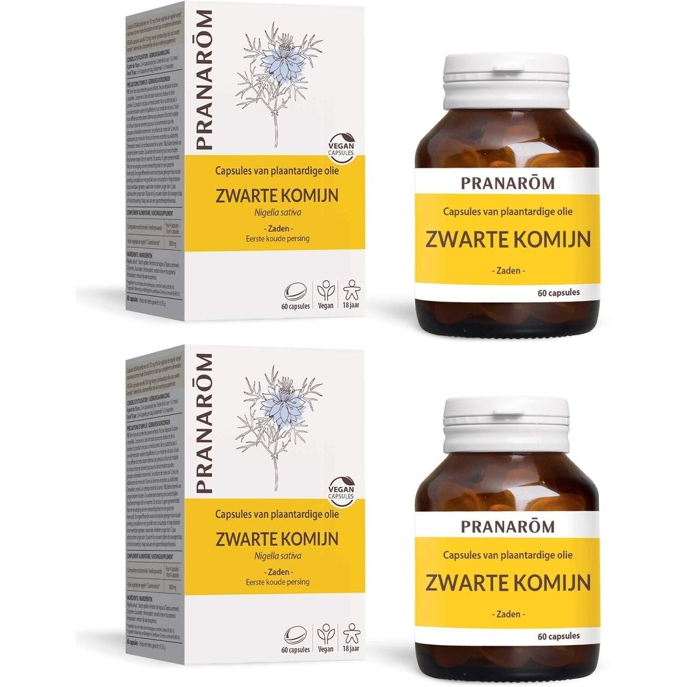 Twee dozen en twee flessen capsules. Opschrift: Zwarte Komijn, Capsules van plantaardige olie, Vegan-label.