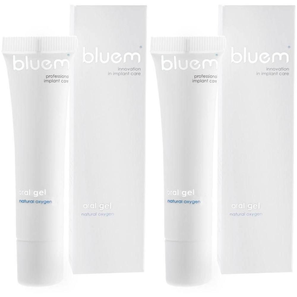Deux tubes et emballages de gel buccal Blue® m. Tubes blancs avec texte bleu. Emballages avec logo bleu.