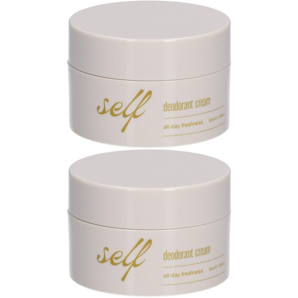 Twee crèmekleurige potjes met deksel. Opschrift "self deodorant cream all-day freshness". Gouden letters.