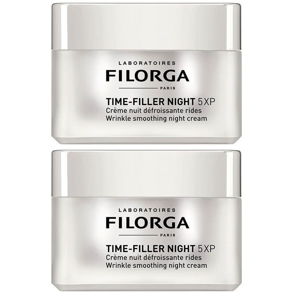 Twee witte potten met deksels. Opschrift: FILORGA, TIME-FILLER NIGHT 5XP, Crème nuit défroissante rides, Wrinkle smoothing night cream.