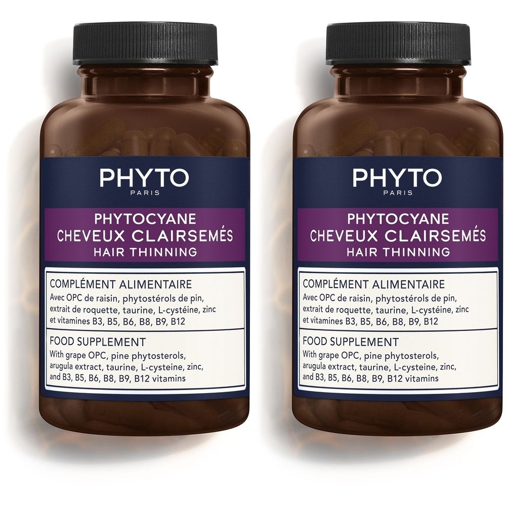 Twee flessen met capsules. Opschrift: PHYTOCYANE, haaruitval. Voedingssupplement. Bevat vitaminen en mineralen.