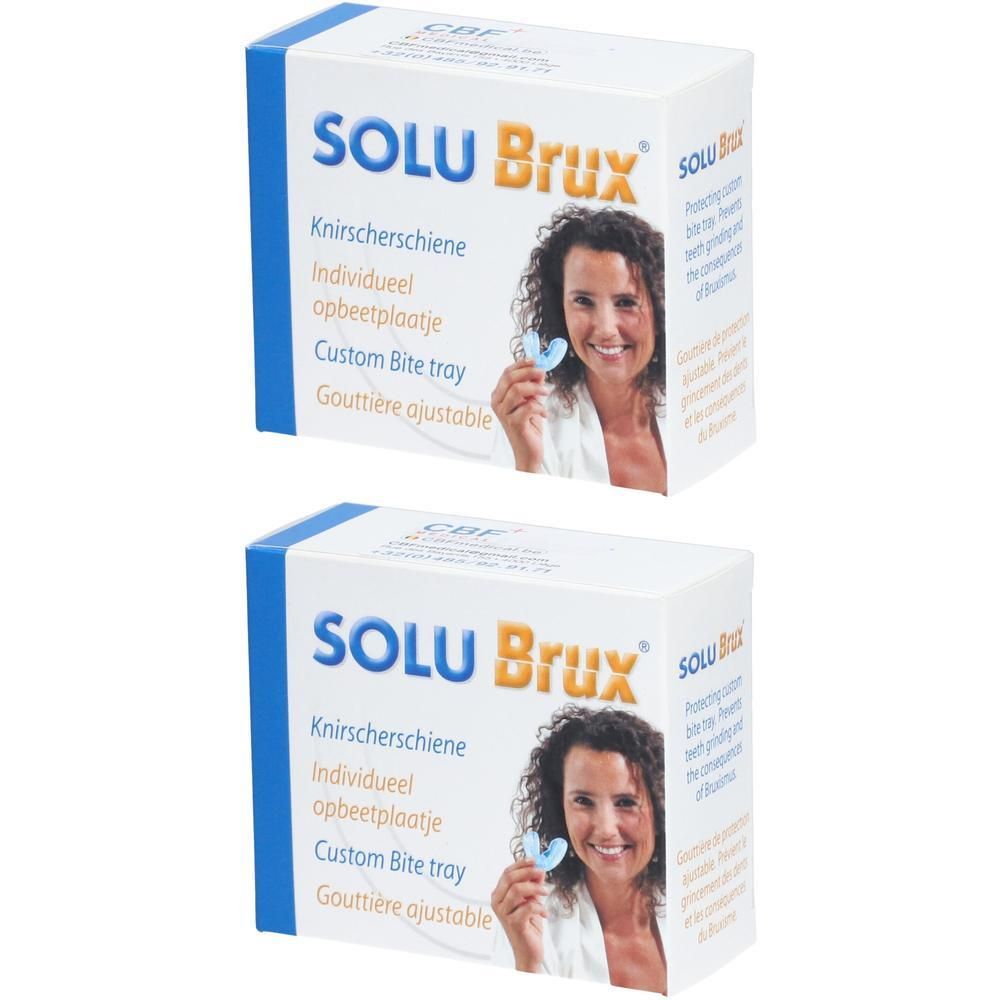 Twee witte dozen met blauwe tekst SOLU Brux. Opschrift: Knirschierschiene, Custom Bite Tray, Gouttière ajustable.