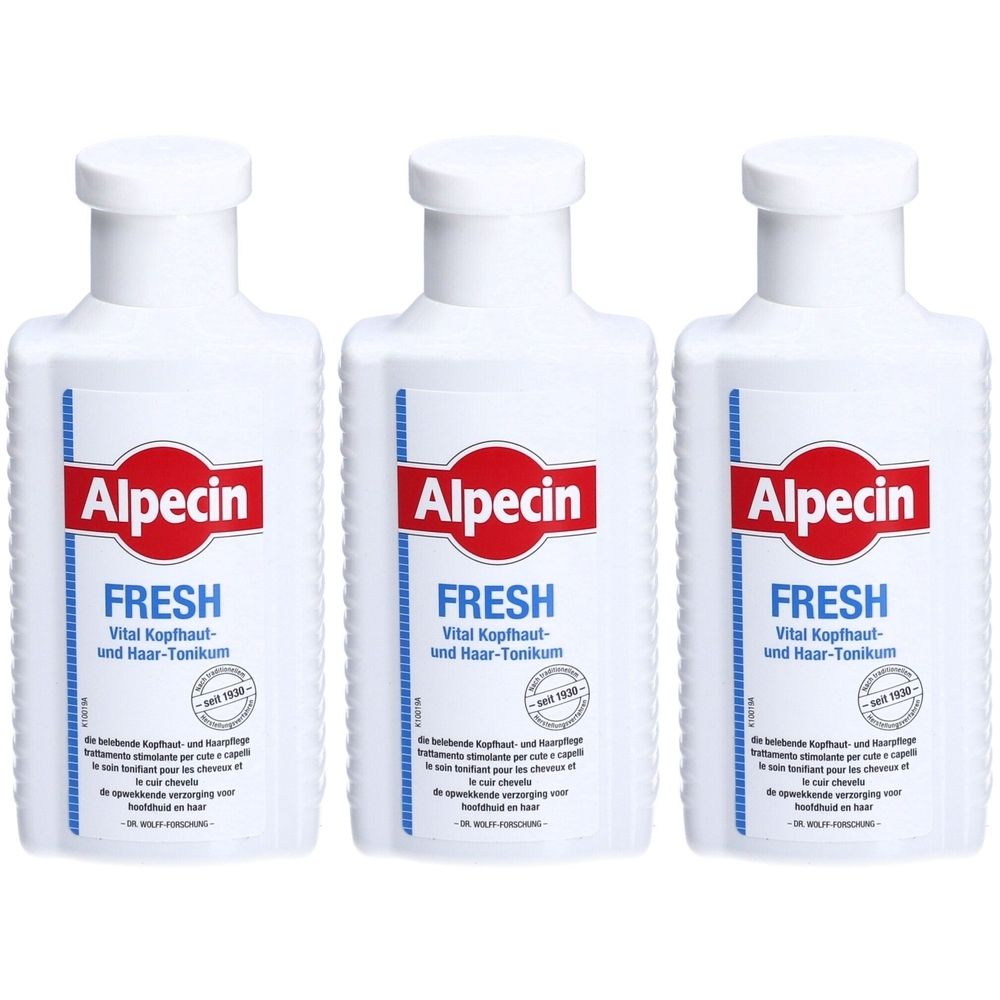 Trois flacons blancs avec étiquettes rouges et bleues. L'étiquette indique "Alpecin FRESH" et d'autres informations sur le produit.