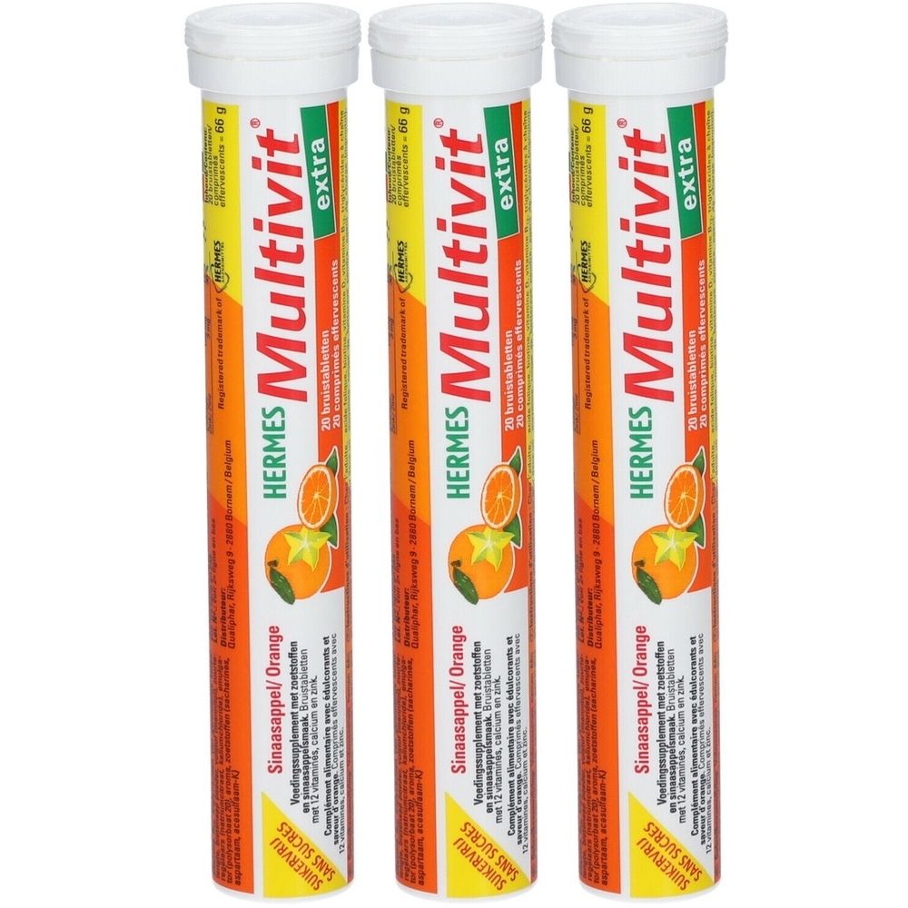 Trois tubes cylindriques. Inscription: Hermes Multivit extra. Étiquette orange avec illustration de fruit. Bouchons blancs.