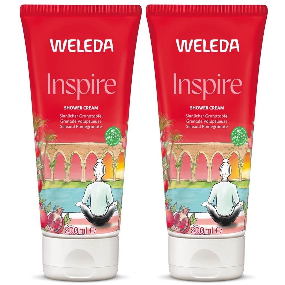 Twee rode tubes douchecrème. Opschrift: WELEDA Inspire, SHOWER CREAM, Granaatappel. Illustratie van een persoon in meditatie.