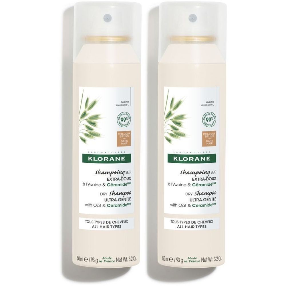 Twee Klorane droogshampoo flacons. Witte spray met groene plantmotieven en productinformatie. Voor alle haartypes.