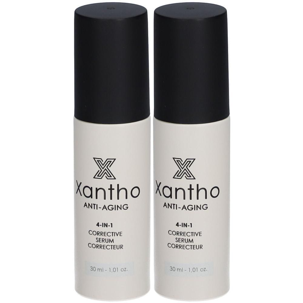 Deux flacons de sérum anti-âge Xantho. Flacons blancs avec bouchon noir. Inscription : Xantho, Anti-Aging, 4-IN-1, Corrective Serum.