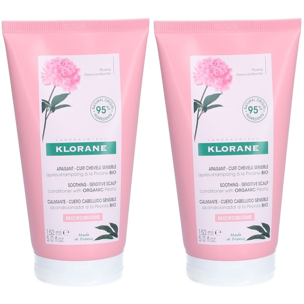 Deux tubes roses. Sur chacun : logo, texte, illustration florale, 95% ingrédients naturels. Inscription : Klorane. Contenance : 150 ml.