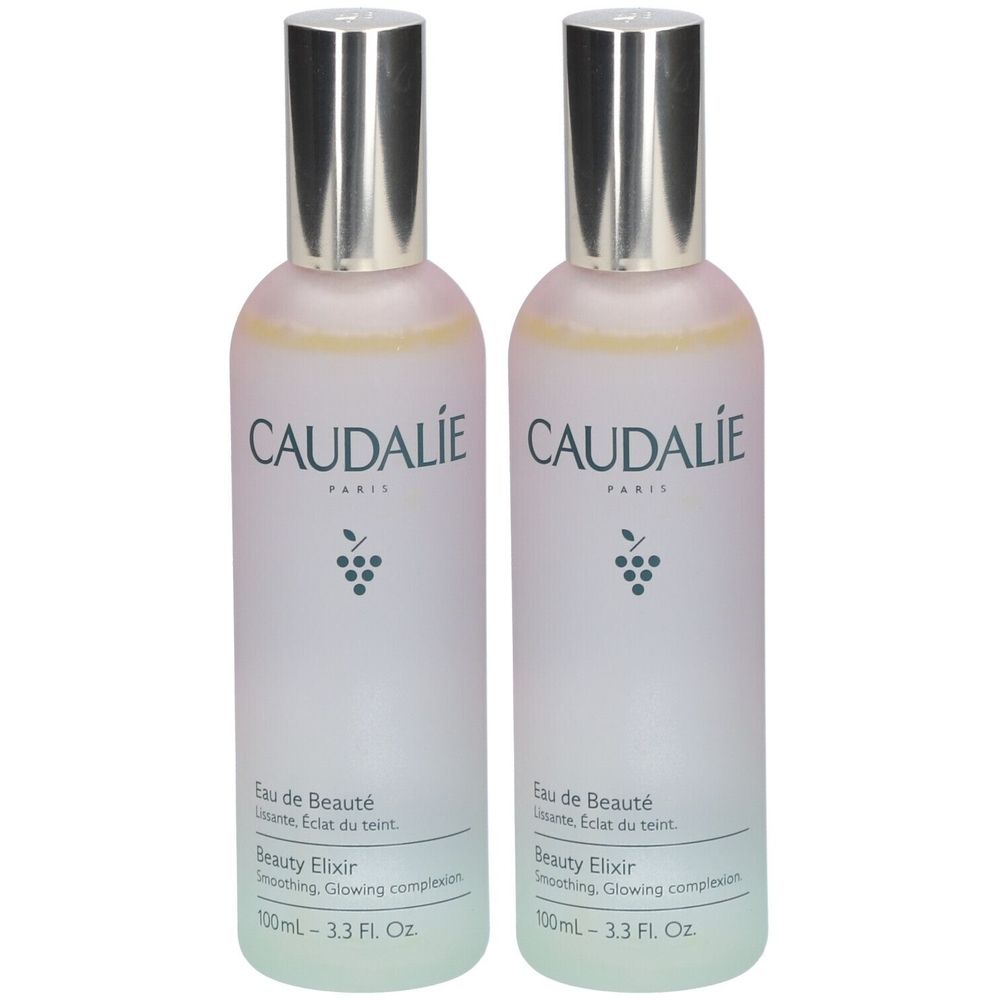 Deux flacons de CAUDALIE Eau de Beauté. Flacons blancs avec bouchons argentés. Inscription: Eau de Beauté, Beauty Elixir.
