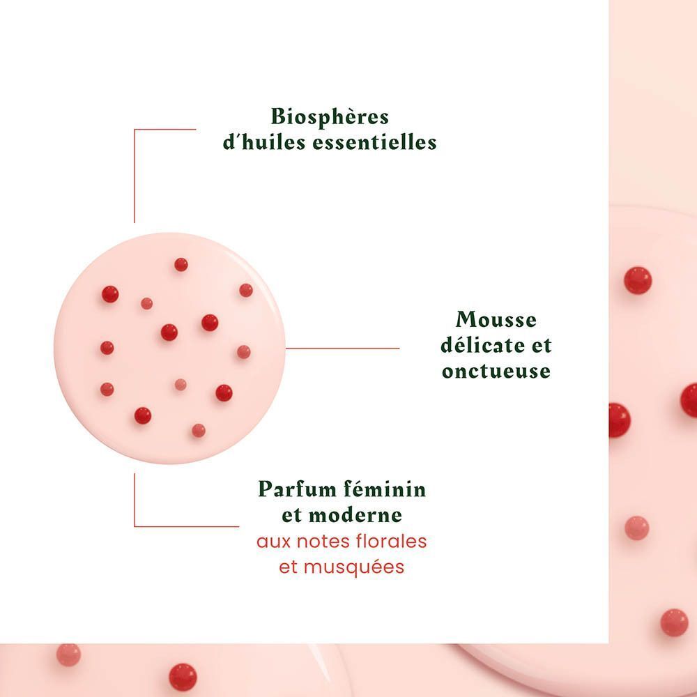 Mousse rose avec des perles rouges, entourée de texte décrivant des huiles essentielles et un parfum.
