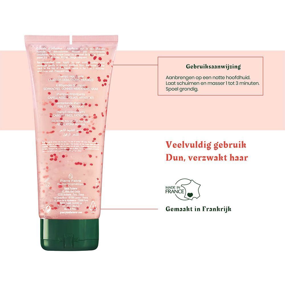 Transparante tube met roze gel en rode deeltjes, groene dop. Gebruiksaanwijzing in het Nederlands.
