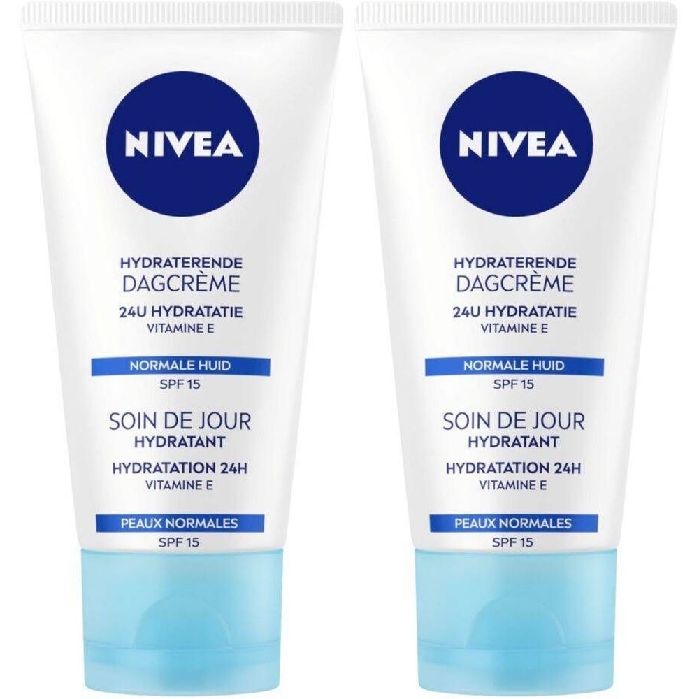 Twee tubes NIVEA dagcrème. Witte tubes met blauwe dop en logo. Tekst: Hydraterende Dagcrème, Soin de Jour, SPF 15.