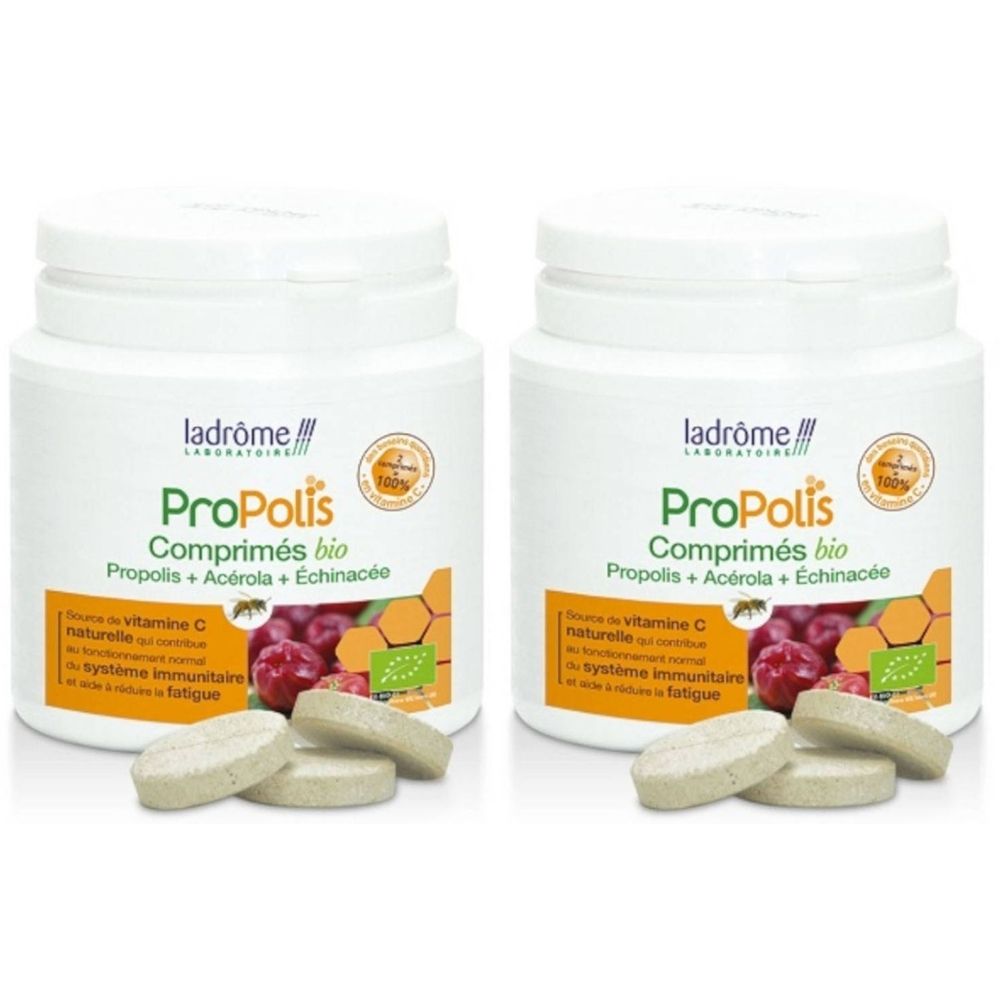 Twee witte flacons met Propolis bio tabletten. Opschrift: Propolis + Acerola + Echinacea. Enkele tabletten liggen ervoor.