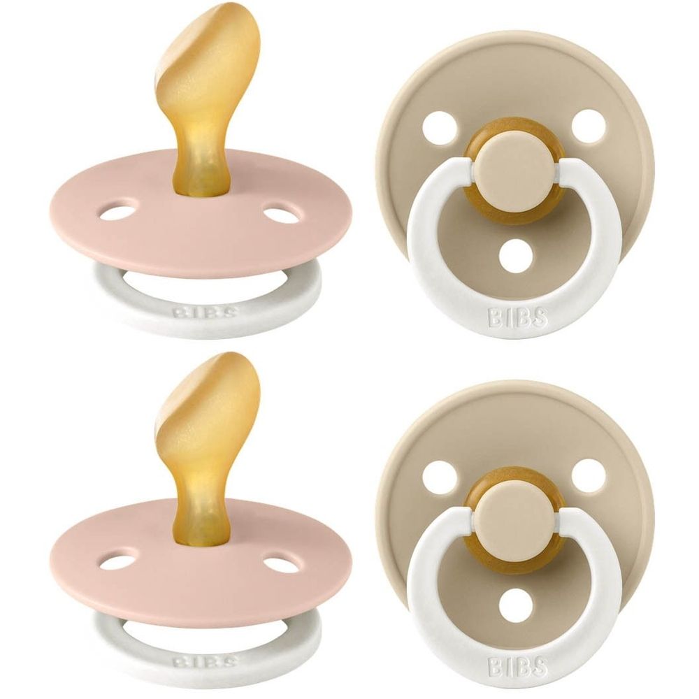 Vier fopspenen. Twee roze, twee beige. Ronde vorm, siliconen speen, ring met BIBS-opschrift. Anatomische vorm.