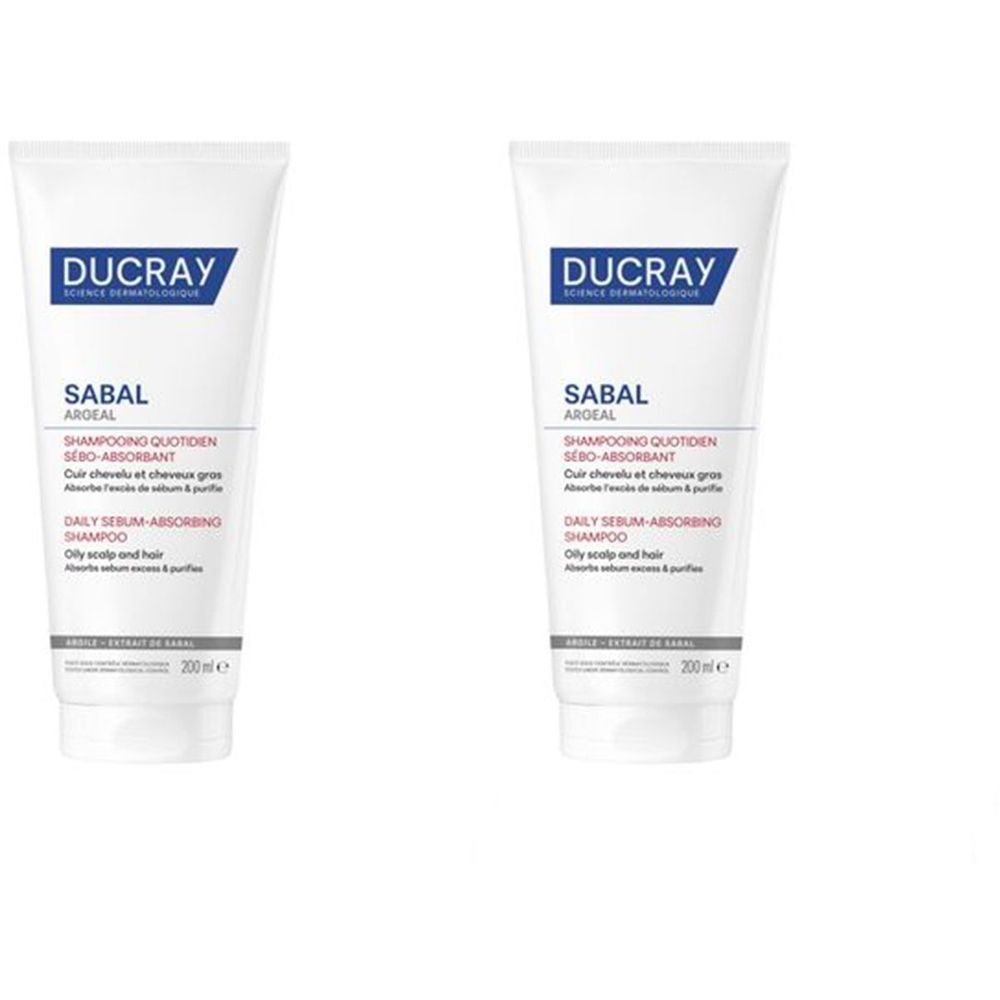 Deux tubes de shampooing Ducray SABAL. Blanc, avec texte bleu et gris. Texte: SABAL, Shampooing Quotidien sébo-absorbant.