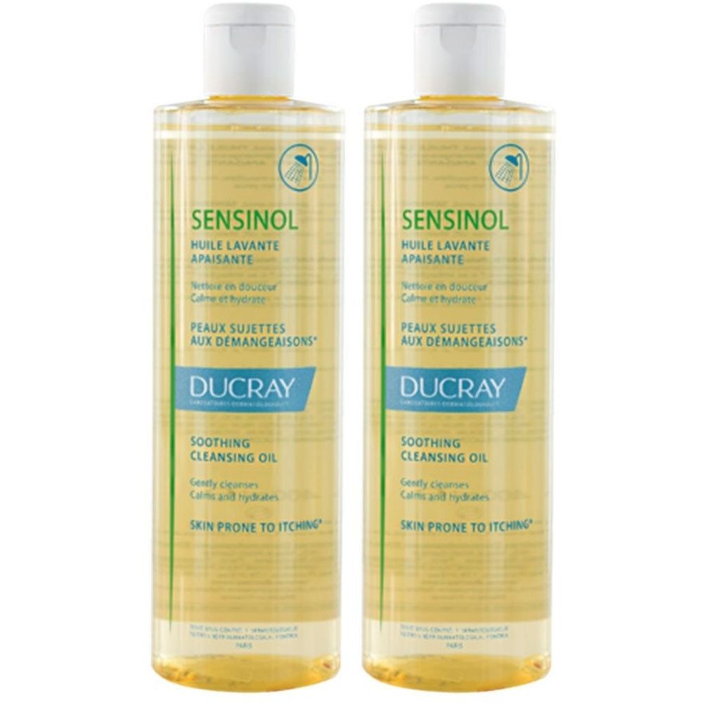 Deux flacons de Sensinol Huile Lavante apaisante. Inscriptions: Ducray, Peaux sujettes aux démangeaisons, Soothing Cleansing Oil.