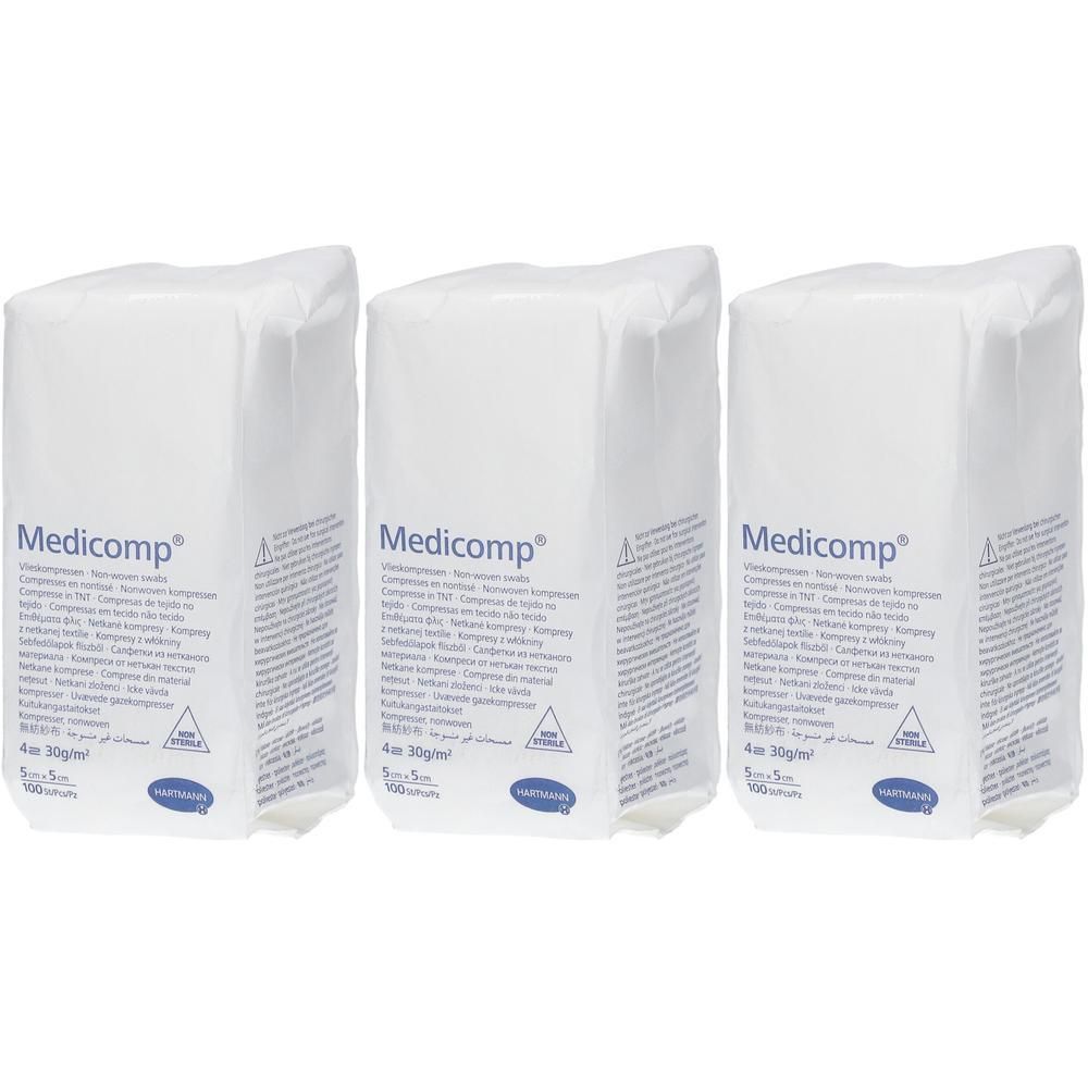 Drie witte verpakkingen met de opdruk "Medicomp". Op elke verpakking staan informatie en een logo.
