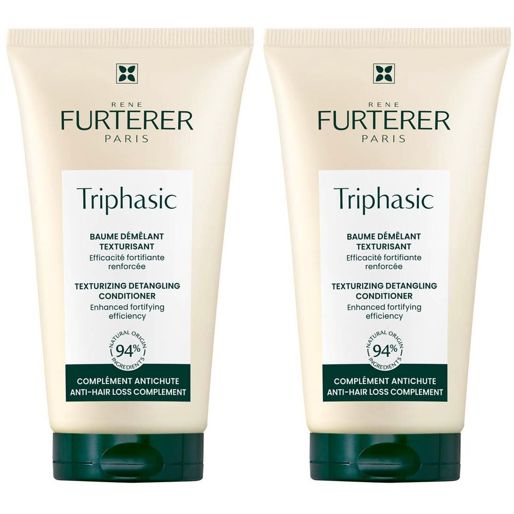 Twee tubes René Furterer Triphasic conditioner. Wit-beige tubes met groene doppen. Tekst en logo.