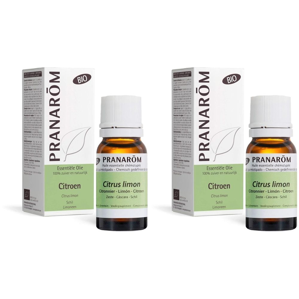 Twee flesjes en dozen. Opschrift: Pranarôm, Bio, Citrus limon. Flesjes bruin glas, witte dop.