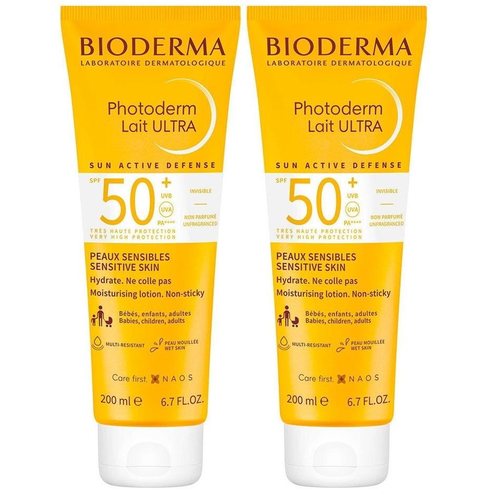 Twee gele tubes met witte dop. Opschrift: Bioderma Photoderm Lait Ultra SPF50+. Voor gevoelige huid. 200 ml.