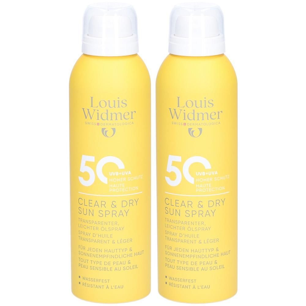 Twee gele sprays met witte doppen. Opschrift: Louis Widmer, Clear & Dry Sun Spray SPF50. Tekst in het Duits, Frans.