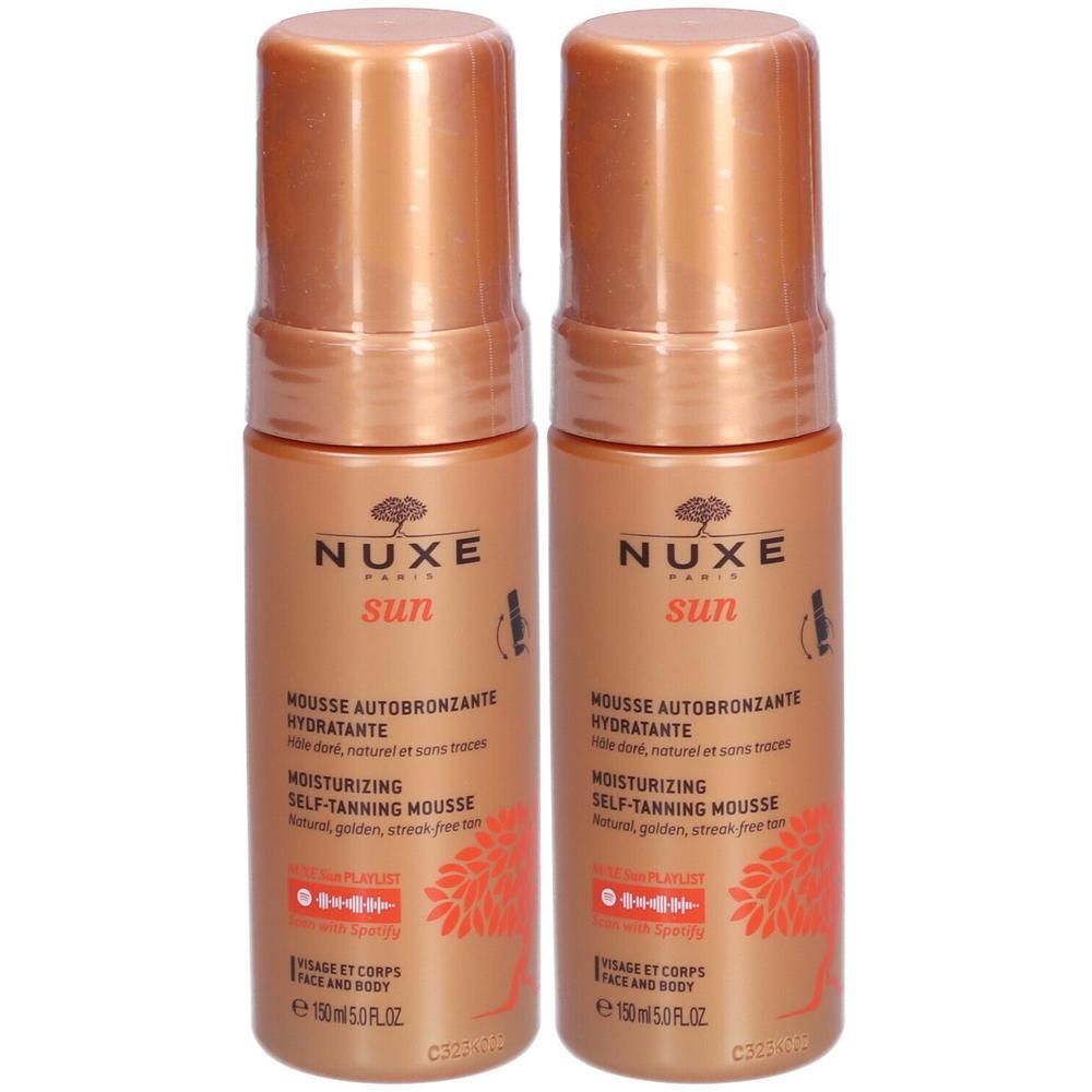 Twee flessen Nuxe Sun Mousse Autobronzante. Zelfbruinende mousse, goudkleurig, met logo en tekst. 150 ml.