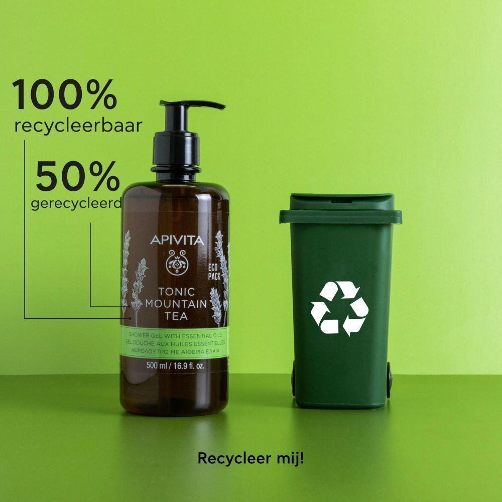 Apivita Tonic Mountain Tea douchegel naast een groene vuilnisbak met recycling symbool.