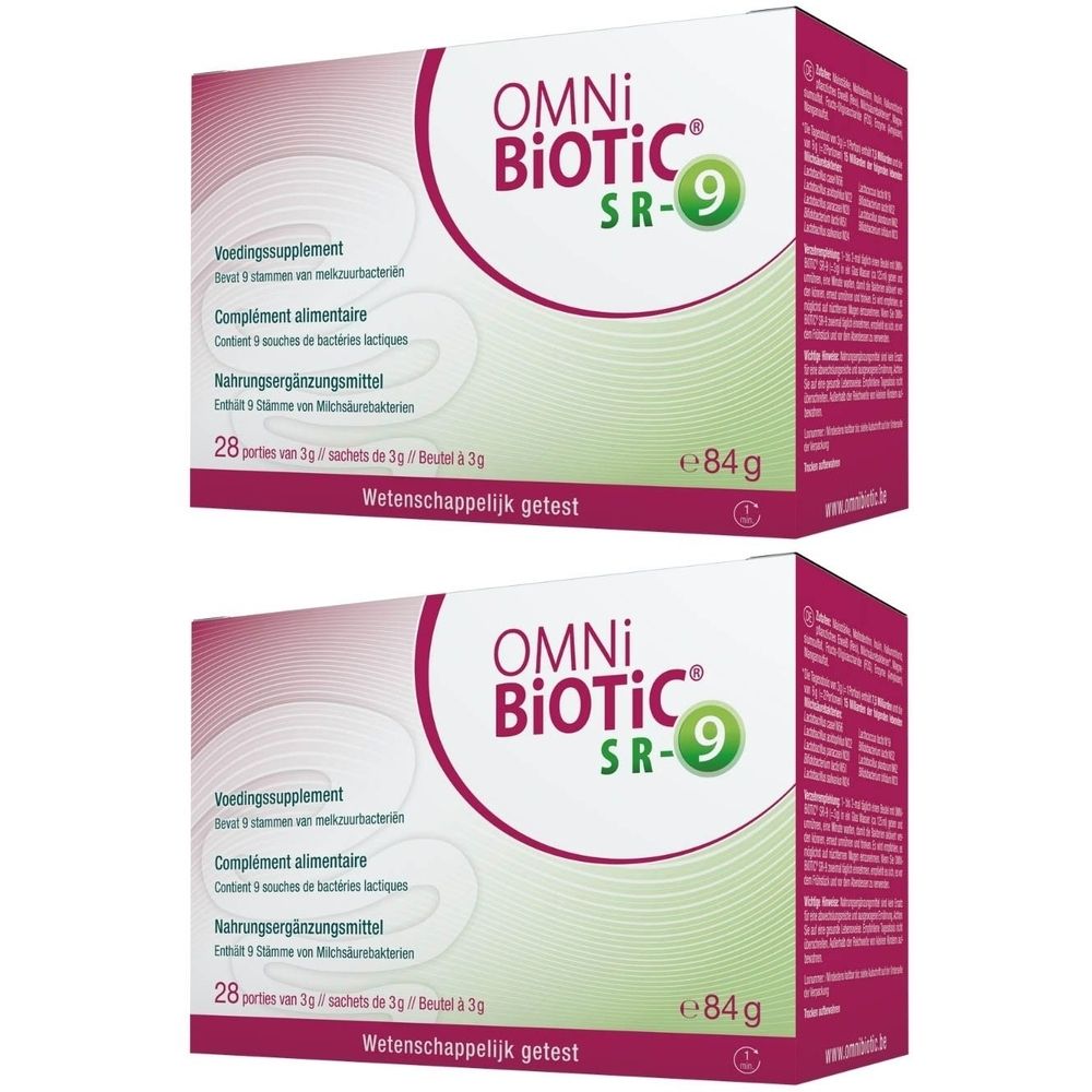 Deux boîtes de Omni-Biotic SR-9. Boîtes blanches avec accents roses et verts. Inscription : Complément alimentaire, 28 sachets, e84g.