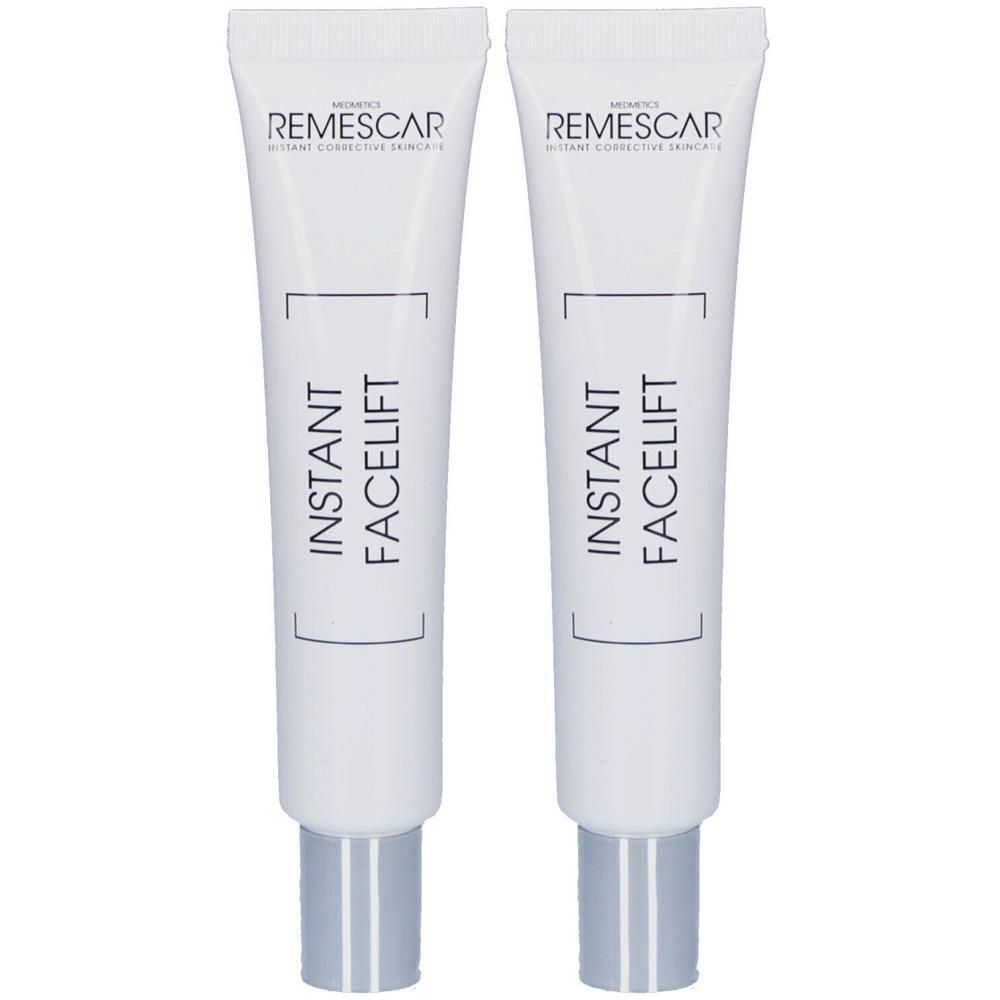 Deux tubes de Remescar Instant Facelift Crème. Tubes blancs avec bouchons argentés. Inscriptions noires.