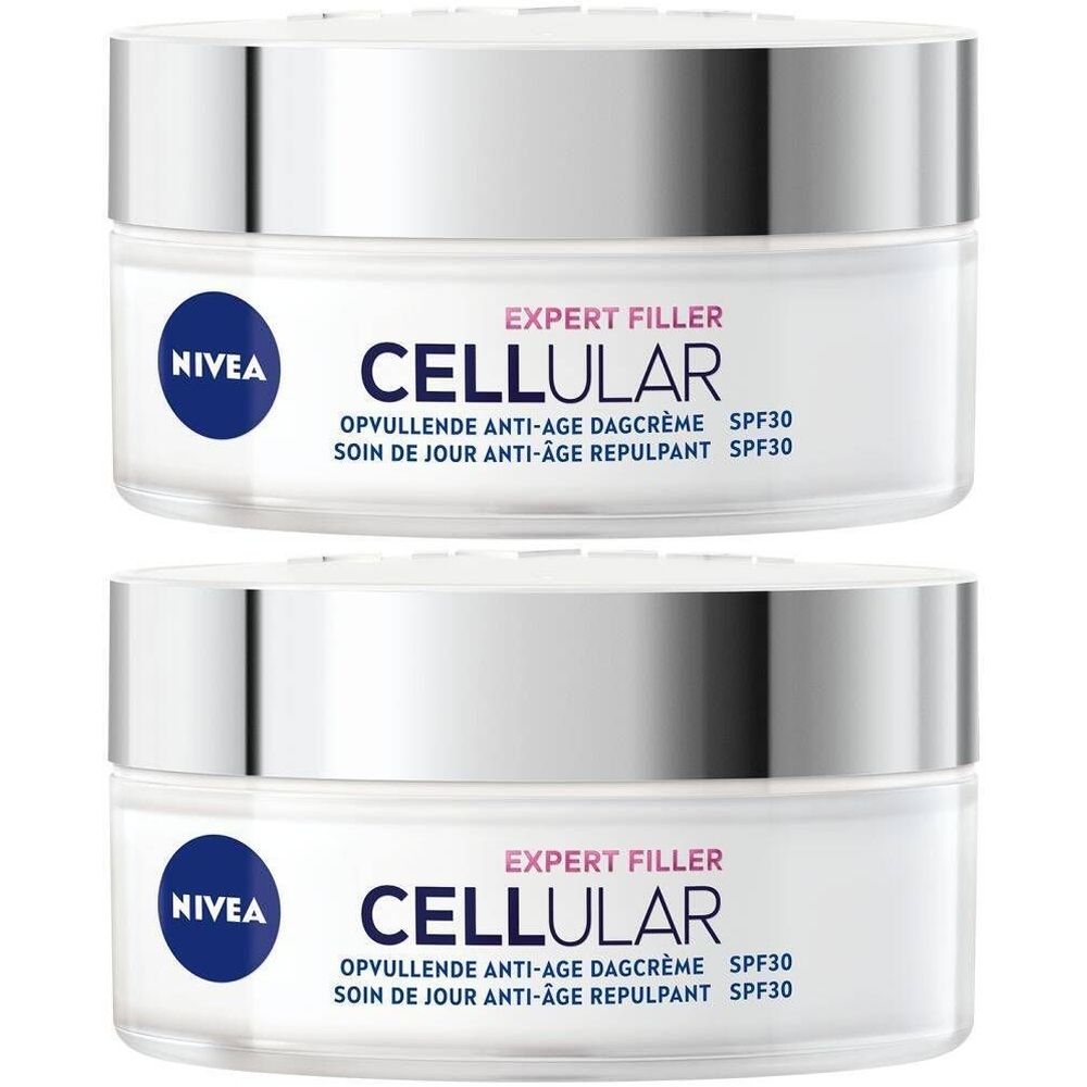 Deux pots de crème avec couvercles argentés. Inscription: NIVEA, CELLULAR, EXPERT FILLER, crème de jour anti-âge SPF30. Pots blancs avec logos bleus.