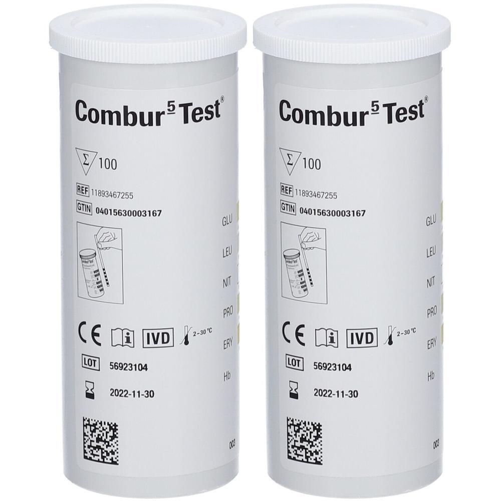 Twee witte cilindrische containers. Opschrift: Combur 5 Test, 100 tests, CE-markering, IVD-symbool, lotnummer en vervaldatum.