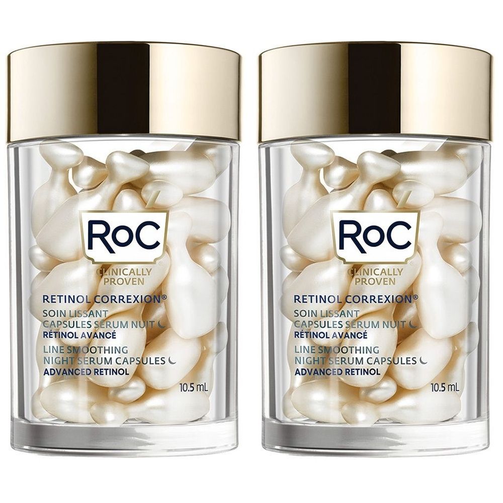 Deux flacons transparents avec couvercles dorés remplis de capsules blanches. Inscription: RoC Retinol Correxion.