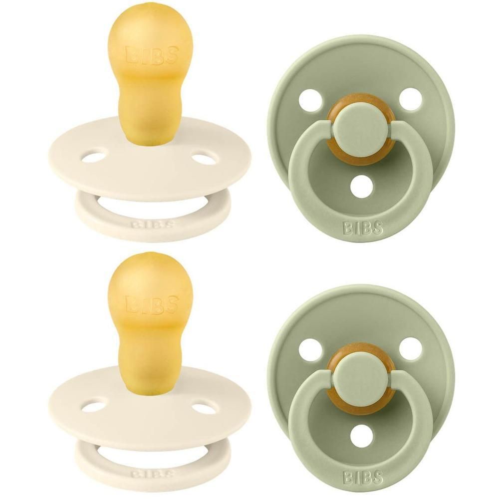 Deux sucettes ivoire et sauge. Tétines rondes. Boucliers ronds. Logo BIBS visible sur les boucliers.