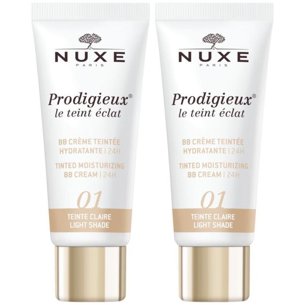 Twee tubes Nuxe Prodigieux BB Crème Teintée Hydratante 24h. Opschrift: 01 Teinte Claire. Witte tube met gouden dop.