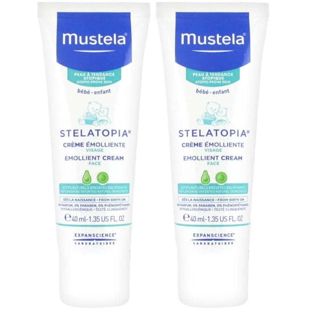 Twee tubes Mustela Stelatopia gezichtscrème. Wit, met blauwe en groene tekst. Bevat 40 ml.
