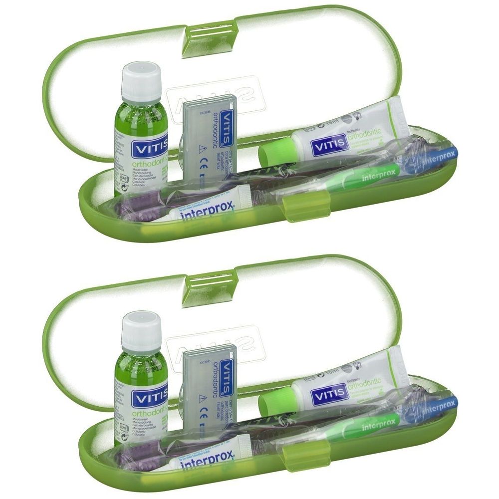 Groene, ovale etui met mondspoeling, tandpasta, tandenborstel en Interprox-borstels. Vitis-logo zichtbaar.