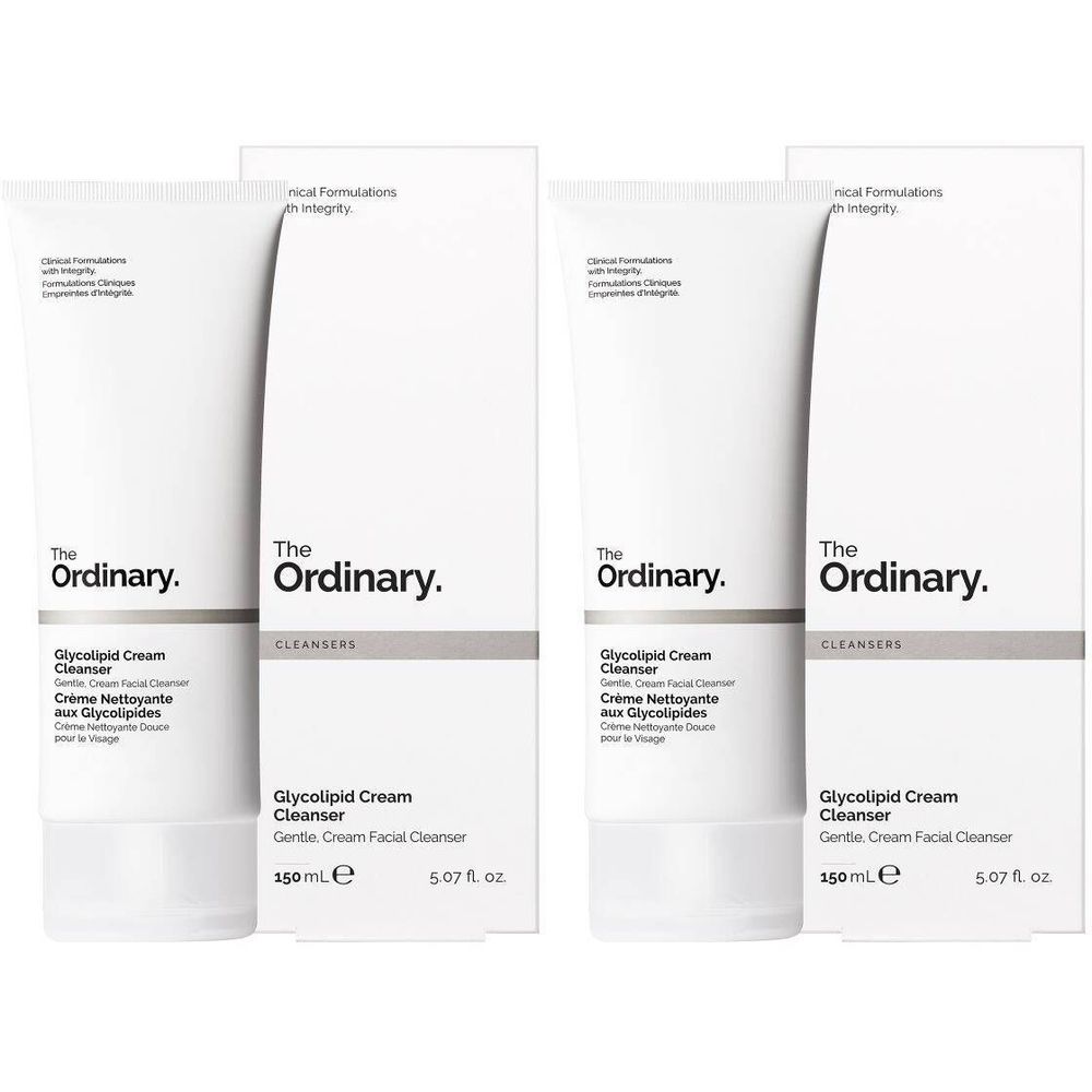 Twee tubes en verpakkingen van The Ordinary. Opschrift: Glycolipid Cream Cleanser. Witte tubes met zwarte tekst.