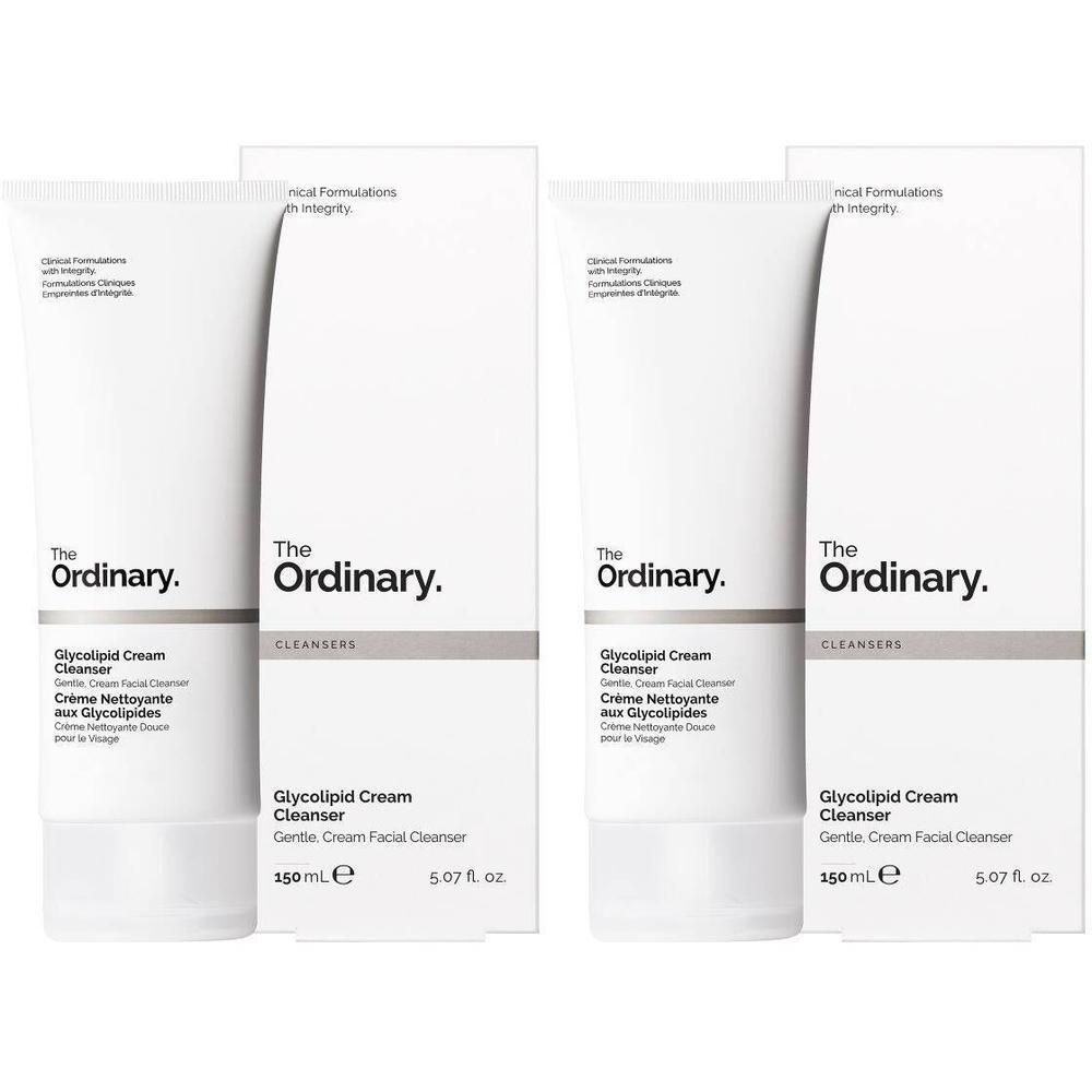 Twee tubes en verpakkingen van The Ordinary Glycolipid Cream Cleanser. Witte tubes met zwarte tekst, in witte dozen.