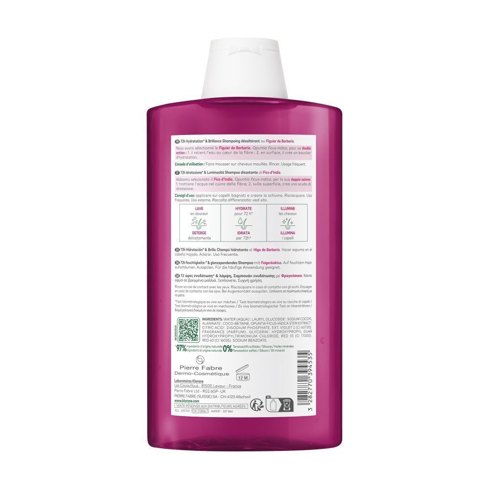 Achterkant van een roze Klorane shampoo fles. Tekst en logo's. 97% ingrediënten van natuurlijke oorsprong.