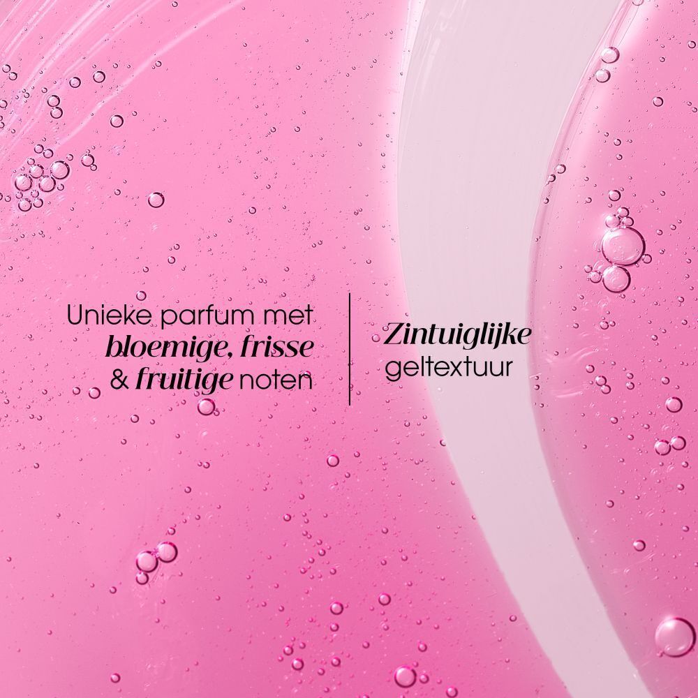 Roze vloeistof met bellen. Tekst: Unieke geur met bloemige, frisse & fruitige noten. Gel textuur.