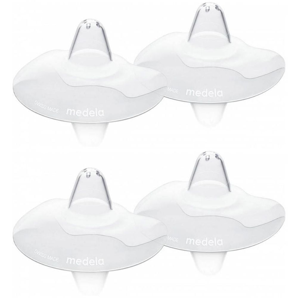 Quatre bouts de sein transparents. Marque : medela. En silicone. Forme arrondie avec trou central.