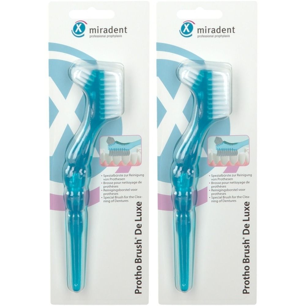 Deux brosses à dents Miradent Protho Brush De Luxe bleues sur emballage. Manche et tête bleus, poils blancs.